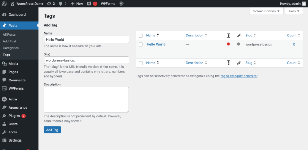 WordPress 'Add Tag' screen demonstrating how to add a new tag with 'Hello World' name and a custom 'wordpress-basics' slug for SEO.