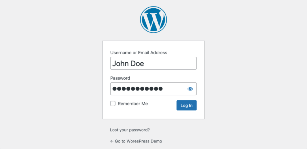 WordPress login screen showing username 'John Doe', a masked password field, 'Remember Me' checkbox, and 'Log In' button.