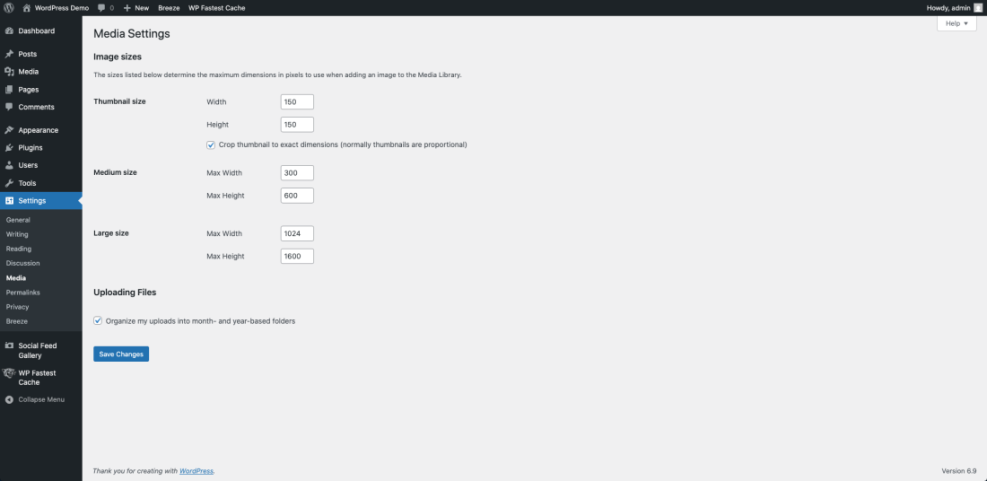 WordPress Media Settings page showing default image sizes for thumbnails, medium, and large images, along with upload organization options. Essential for optimizing images.